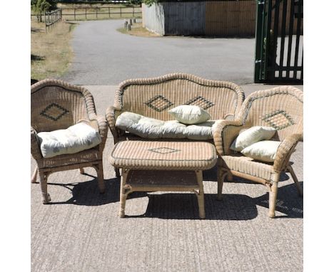 A rattan conservatory set, comprising of a sofa 130cm, two armchairs and a coffee table