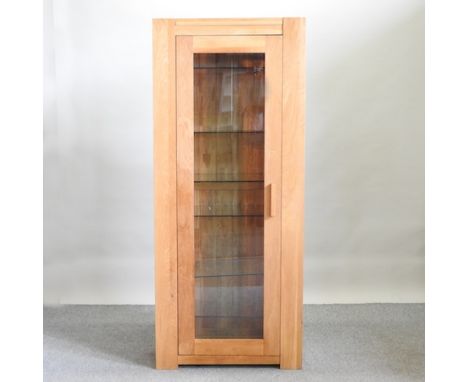 A light oak display cabinet, containing a built in interior light and adjustable glass shelves, 80cm