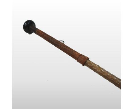 A 19th century basque makhila wooden walking stick, with a concealed spike and braided handle, 89cm long 