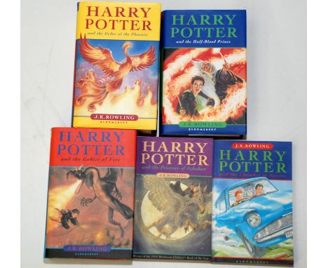 Four Harry Potter hardback books, each the first edition with dust jacket, together with two paperbacks.