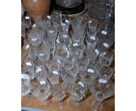 A collection of cut stemmed glasses and a decanter.