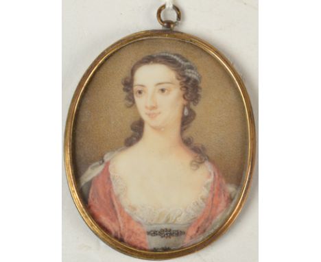 An 18th century portrait miniature of a beauty with pearls in her hair, 5.3 x 4.3cm.   Condition report: No warping or cracki