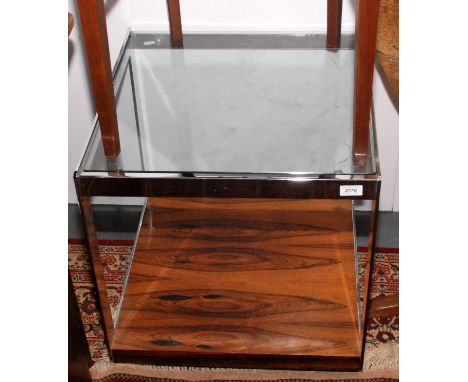 A 1970s/80s 53.5cm square chrome trolley with a plate glass top and rosewood veneered low shelf, height 54cm.   Condition Rep