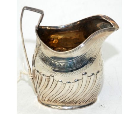 A George III helmet milk jug by Peter and Anne Batemen, London 1797, the body engraved and fluted, 3oz.