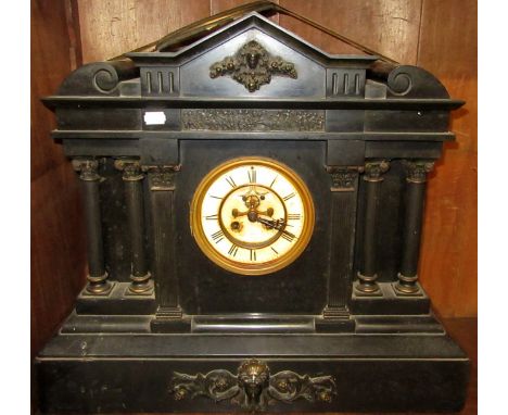 A large black marble cased architectural mantel clock, with revealed escapement.