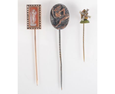 A cold painted model automaton pin with windmill finial, together with a Mephistopheles pin and a cameo pin.