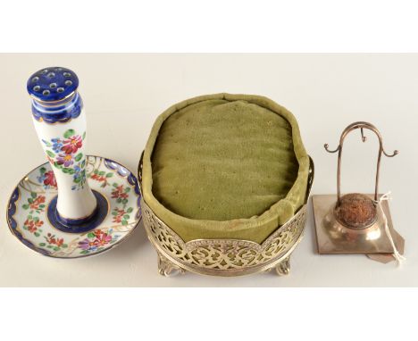 A silver pin and ring stand, Chester 1920, together with a pin cushion and a ceramic hat pin stand.