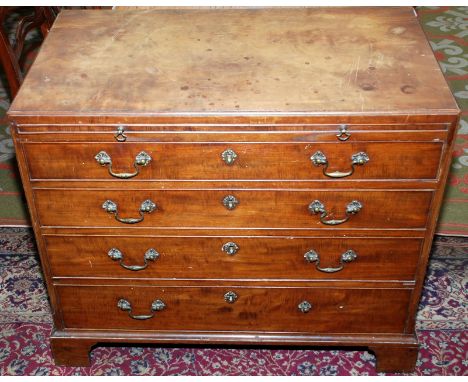 A George III caddy top chest of small proportions with a brushing slide over four long graduated drawers on bracket feet.