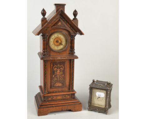 A continental mantle clock in the form of a longcase clock.