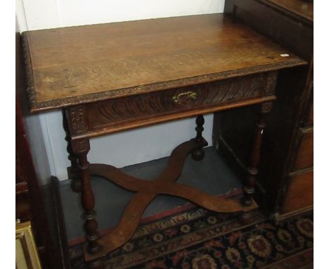 A light oak small side table in late 17th century style with single drawer and 'X' stretcher.