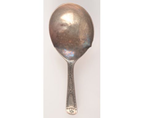 A George III silver caddy spoon.