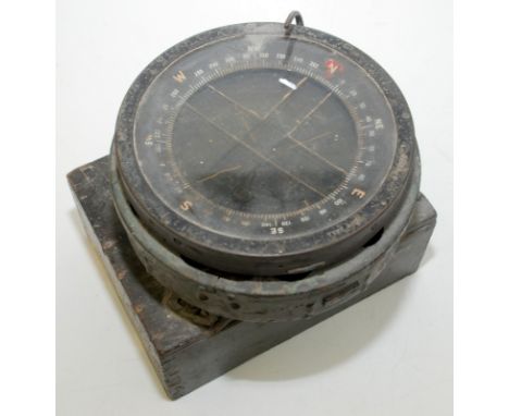 An ex W.D. compass on a sprung metal mount, diameter 16.8cm. 