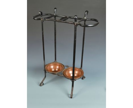 An Art Nouveau cast iron stick stand by Benson with two copper trays, these marked Benson and with the registration number 39