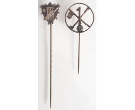A silver hole in one golfing pin, and a silver shield finial cricketing pin.