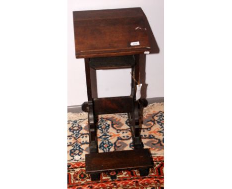 A Victorian gothic oak book rest with a folding kneeler step, height 68cm. 