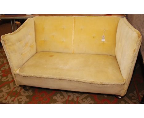 A late 19th century two seat sofa upholstered in buttoned yellow draylon, width 127cm.