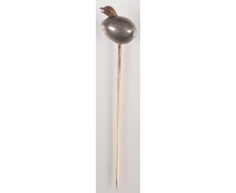 A Victorian or Edwardian pin in gold and silver, the finial in the form of a chick emerging from an egg.