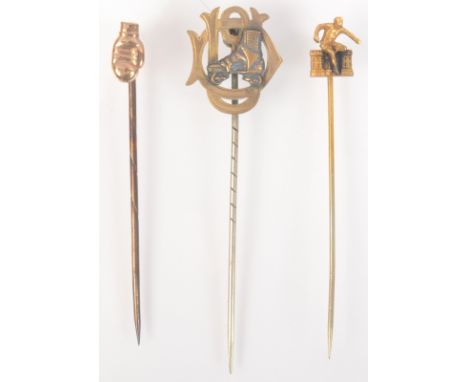 A gold boxing glove pin, a gilt steeple chasing pin and a silver roller skating pin.