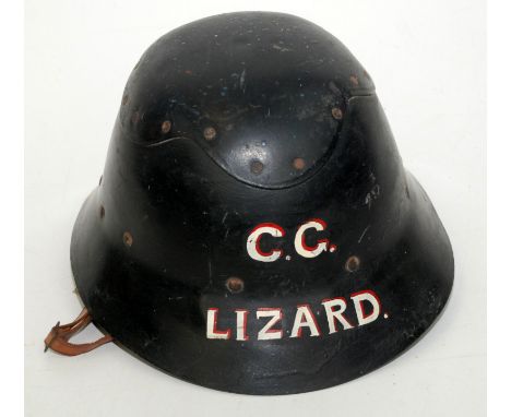 A hard hat for Lizard Coast Guard named in red and cream enamel, maker's label "The Cromwell Protector Helmet".