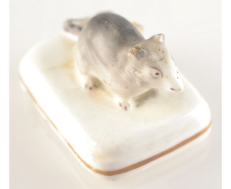 A rare Worcester miniature porcelain mouse, based chipped.