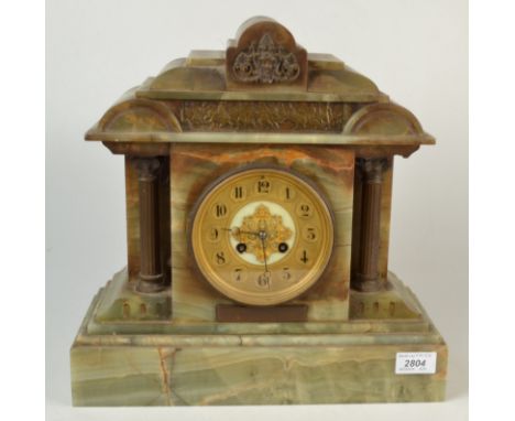 An onyx cased architectural mantle clock.