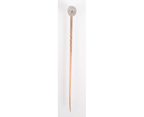 A stick pin set a cushion shape brilliant cut diamond, cased.