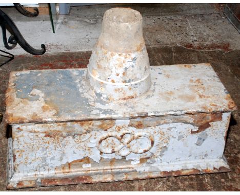A large cast iron water hopper.