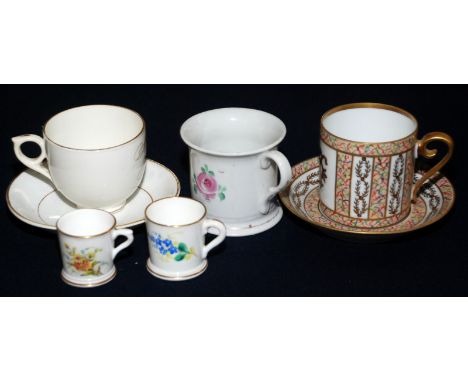 A Worcester Edwardian miniature cup with floral decoration and a Hayle souvenir cup and saucer with gilt script naming, toget