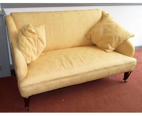 A Victorian small winged sofa upholstered in gold fabric on square section moulded legs, width 140cm. 