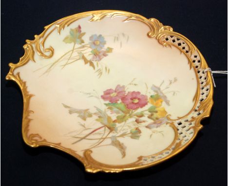 A late Victorian peach ivory rococo shaped Royal Worcester plate, floral decorated and with pierced border.  Condition report