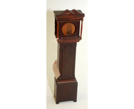 A watch holder in the form of a mahogany longcase clock.