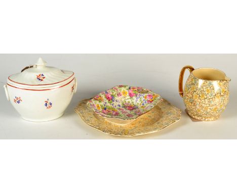 An 18th century New Hall style porcelain sugar box and cover, together with three pieces of Chinz.  Condition Report: No mark