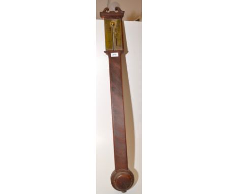 A stick barometer by Watkins, Charing Cross in mahogany case with swan neck pediment.