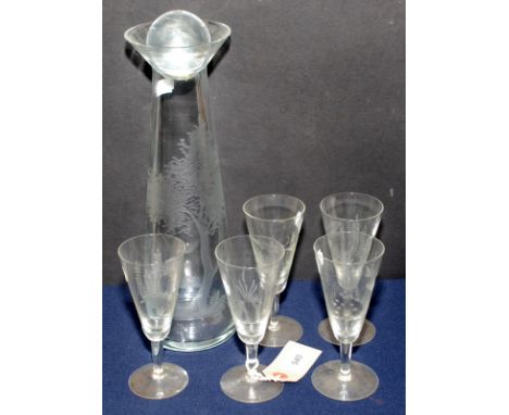 A wine carafe engraved with a fisherman on a riverbank, together with five glasses each with a fish swimming near the riverbe