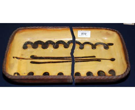 An early Winchcombe Pottery slipware rectangular dish, impressed mark, broken fairly neatly in two pieces.