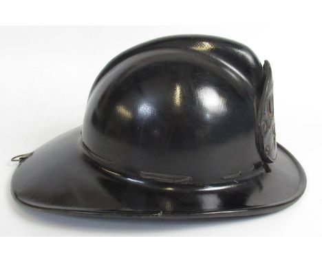 C1940s MSA 'Skullgard' helmet with U. S. Army Fire Department shield, complete with original interior