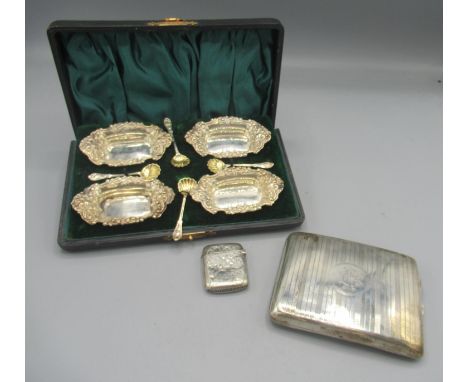 Les Dennis Collection - Edwardian silver cased set of four salts in rectangular form, border decorated with repousse scrolls,