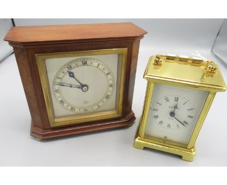 Elliot 8 day walnut mantle timepiece on brass bun feet, brass bezel enclosing signed 3 1/2" silvered dial with applied Roman 