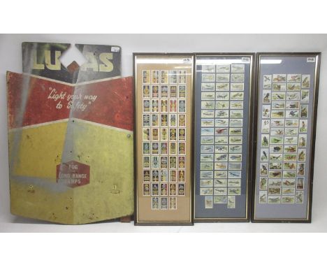 1960's Lucas Fog and Long Range Lamp garage display board, H88cm; three framed sets of Gallaher Ltd. cigarette cards, Army Ba