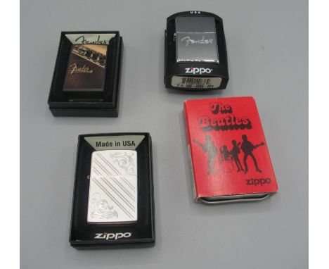 Zippo petrol lighter 'The Beatles', cased with outer cardboard slip; two Zippo 'Fender' petrol lighters, boxed and Zippo 205 