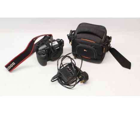 Canon 7D camera body with 18-55mm lens and accessories