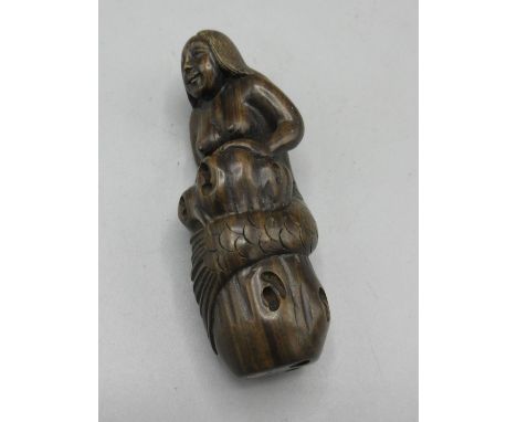 Japanese carved hardwood netsuke in the form of a mermaid, inset bone signature panel, H7.5cm