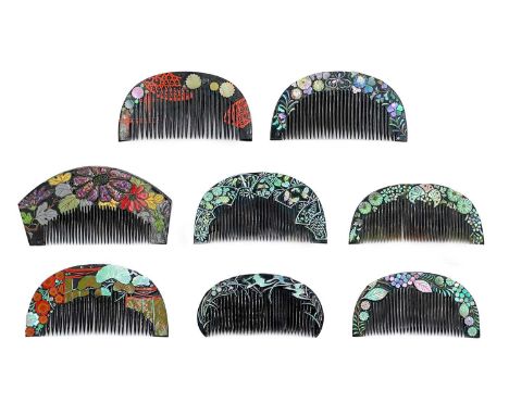 Eight Japanese black lacquer combs, 20th century. Including enamel and mother-of-pearl floral decoration, largest 5.5 x 11cm.