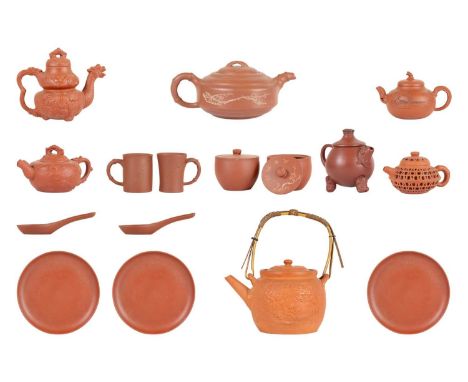 Nine Chinese Yixing teapots. and cups, saucers and plates. (qty)