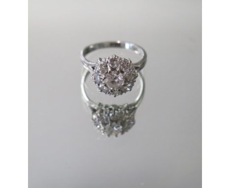 A hallmarked vintage 18ct white gold diamond cluster ring, approx 1.65ct, ring size N, approx 4.7 grams, diamonds bright and 