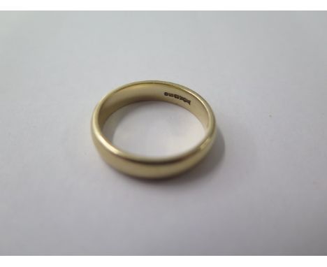 A hallmarked 9ct yellow gold band ring, size R, approx 5.3 grams, some marks consistent with use but generally good 