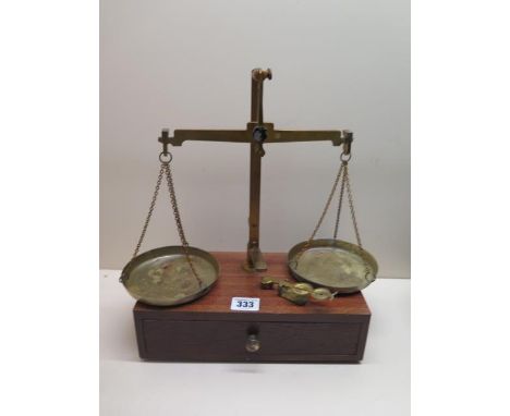 A vintage set of balance scales together with a sovereign scale, scales 33cm tall 