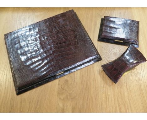 A crocodile three piece desk set, blotter, notepad holder and roller blotter, blotter 40cm x 31cm, generally good condition,s