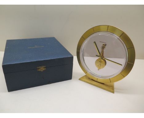 A Jaegar-le-Coultre gilt circular desk clock, 16.5cm tall, manual wind, not currently working, with original box 