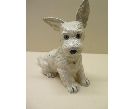 A cast metal Scottie dog table lighter with hinged head, 16cm tall 